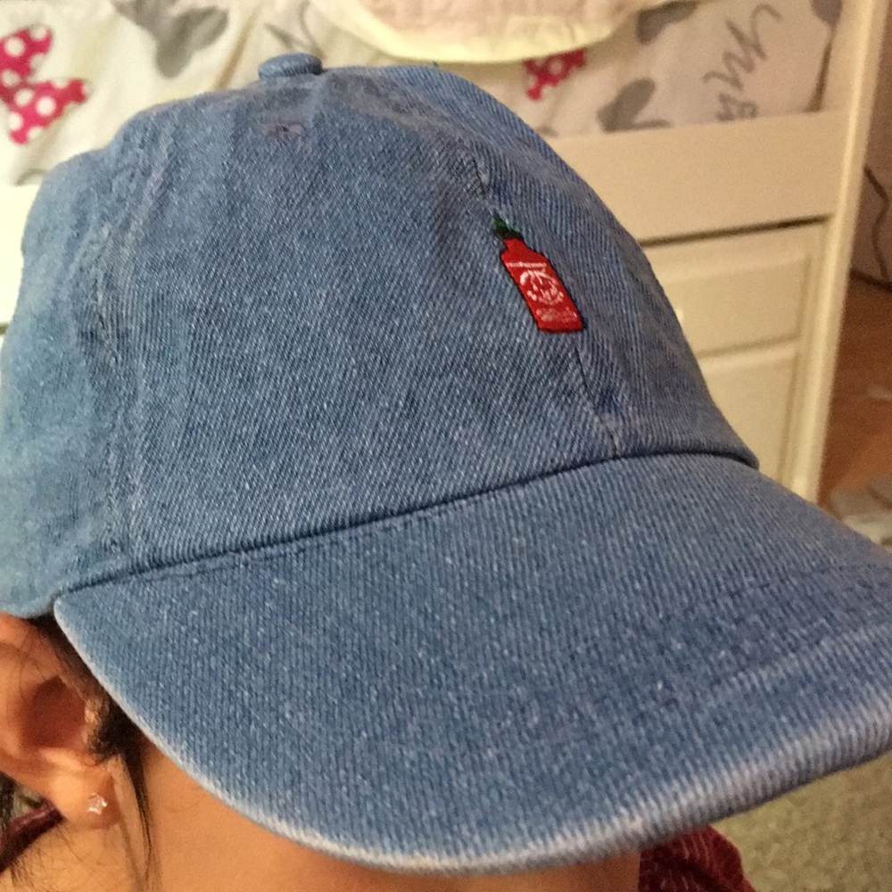 blue jean hat with chili logo on it